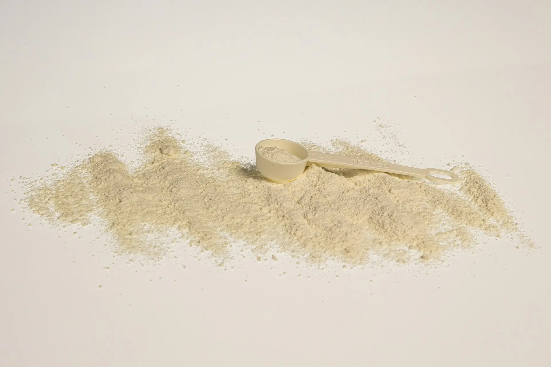 a scoop of powder next to a scoop of powder